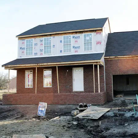 Photo of our house the day all the brick was applied to the exterior.
