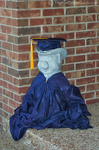 The Franklin Pig in cap & gown during graduation.