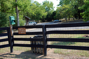 poop-station-and-trash-can-at-far-end-of-dog-park.jpg