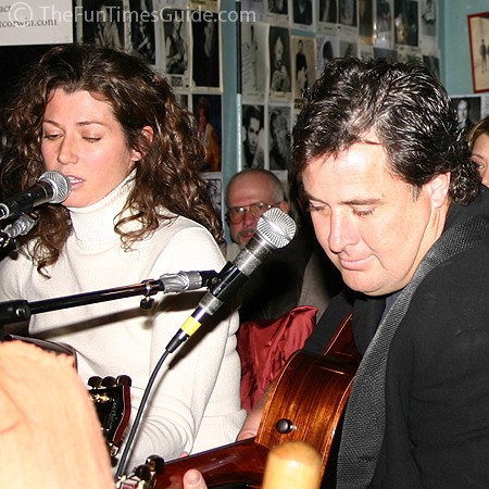 Amy singing while Vince accompanies her on guitar at the Bluebird.