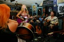 Ashley Cleveland performing at the Bluebird Cafe in Nashville, along with Leslie Satcher and Craig Carothers.