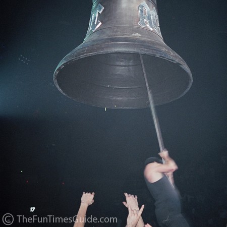 Brian Johnson from AC DC swinging from a giant bell.