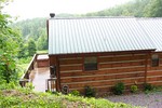 A view of the Sparrow's Nest cabin and the hot tub on the porch.