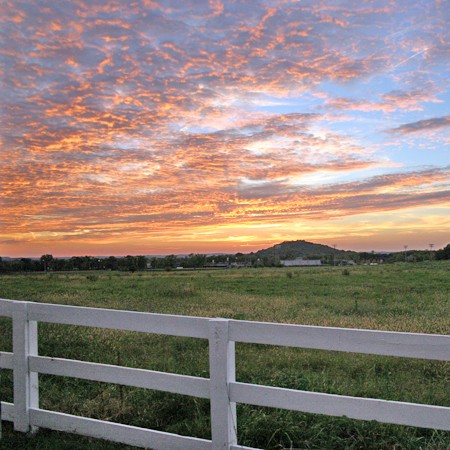 Farm with colorful sky at sunset. Photo Ã‚Â©2004 Jim & Lynnette's Fun Times Guide //thefuntimesguide.com