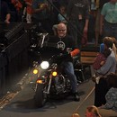 Dr. David Foster entering the Curb Center on his Harley Davidson motorcycle.