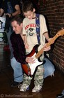 Derek strumming Scott Holt's guitar at BB King's in Nashville.