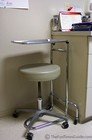 A doctor's chair in a doctor's office.