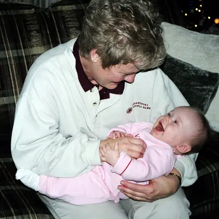 Grandma Kay tickling Karly.