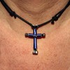 Handmade cross necklace from Ashley Cleveland. The length can be adjusted from a short choker-style to a long chest-length necklace simply by sliding the knots on either side of the cross.