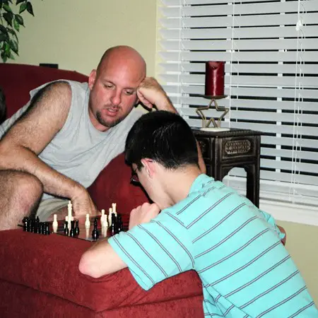James playing a game of chess with Uncle Jim.