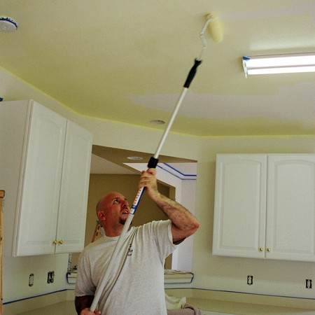 Jim painting the kitchen ceiling.