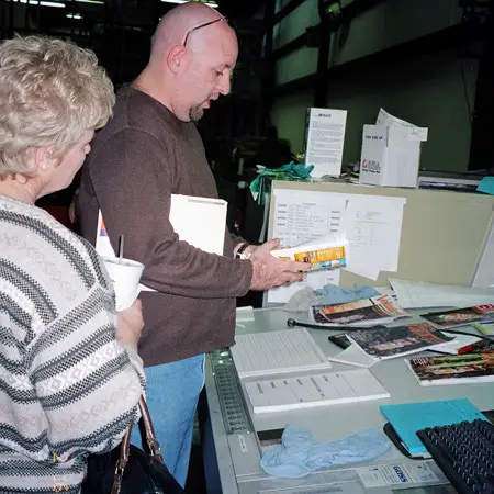 Jim showing Lynnette's mom around the press room at Ambrose.