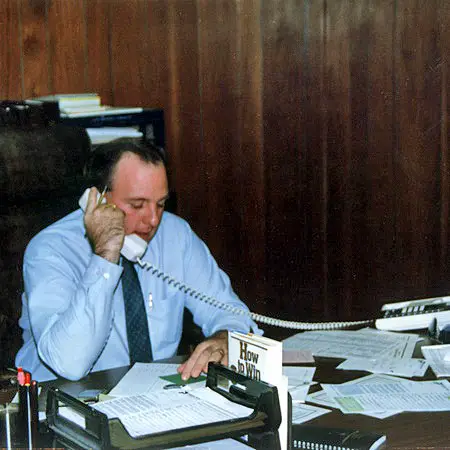 Jim, owner of Dolphin Press Jacksonville Florida, hard at work at his desk in 1988.