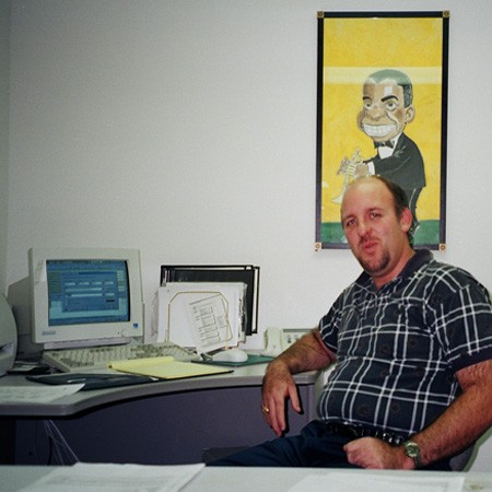Jim at his desk working for Gannett Offset Pensacola.