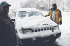 Jim shoveling the many feet of Ohio snow off our car before we head to Indiana