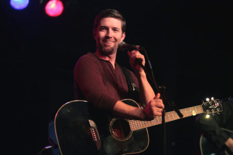 Josh Turner singing at the microphone