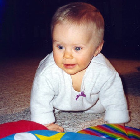 Karly crawling on the floor at 8 months.