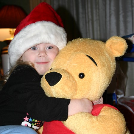 Karly and her Winnie-the-Pooh doll.