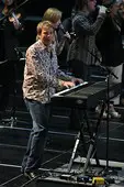 Lionel Cartwright singing and playing keyboards during a Bellevue Community Church service held at the Curb Center.