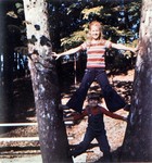 Lynnette and Mike playing in a tree at the park.