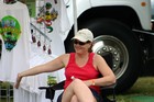 Lynnette giving her best 'Vanna' impression while selling tshirts, etc. from Terry's souvenir tent.