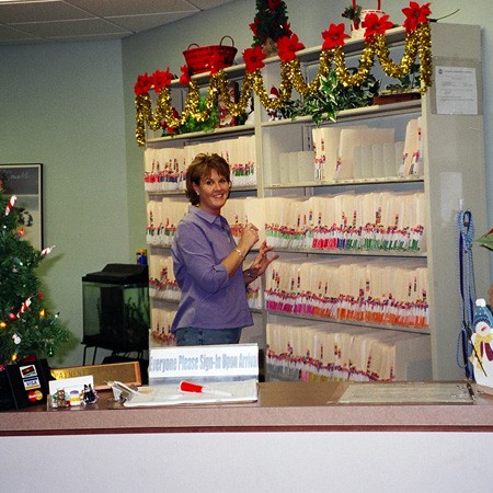 Lynnette filing pet records at Cool Springs Animal Hospital