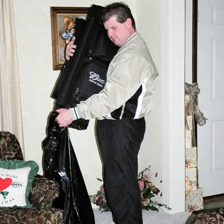 Mike having a hard time parting with the golf bag he gave Jim.