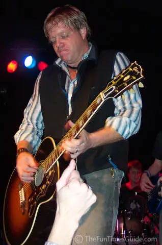 Pat Green in state of deep concentration playing guitar.
