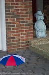The Pig's umbrella hat blew off his head on this windy day.