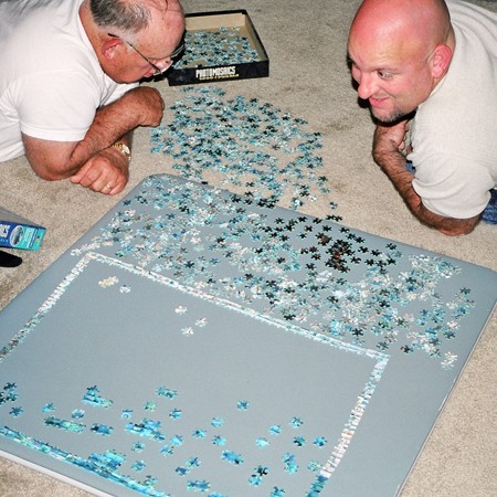 Jim and his dad contributing to the 'community puzzle' during their visit.