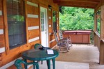 View of the covered porch out back -- doors from the living room and bedroom lead outdoors to the porch.