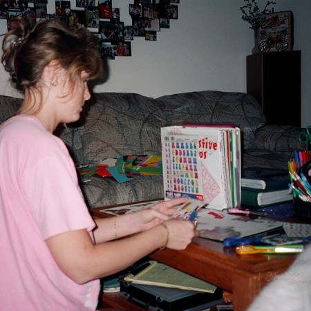 Scrapbooking on my tiny coffee table in Orlando.