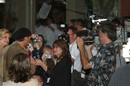 Tim McGraw and Faith Hill surrounded by photographers and television cameras in Franklin, Tennessee.